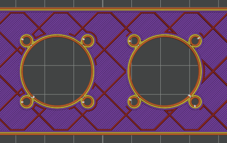 A shot of the same part in the slicer, showing solid filament paths around the relief holes and sparse infill elsewhere.